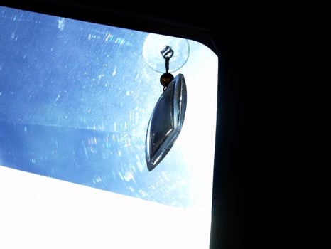 Glass Pendant Ornament Hanging on Car Window photo