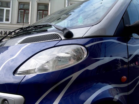 Stylish Compact Car with Decorative Paint Job photo