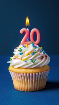 Celebratory cupcake featuring a lit candle and colorful sprinkles for a milestone birthday celebration photo