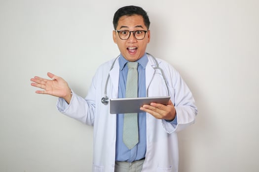 Asian Doctor and tablet hand with blank sign for introduce something photo