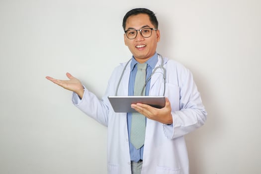 Medical doctor holding tablet and present something photo