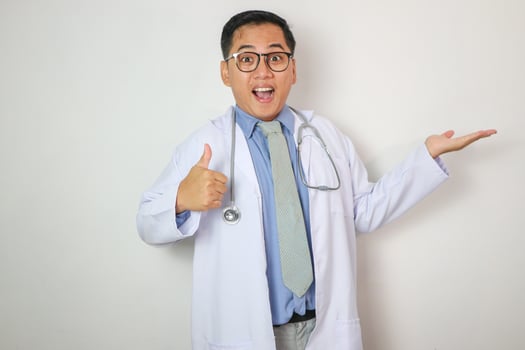 close up of male doctor hand showing thumbs up, on white background photo