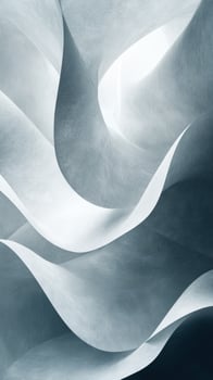 Abstract waves of pale, textured paper create a serene and fluid composition in soft shades of gray and white photo