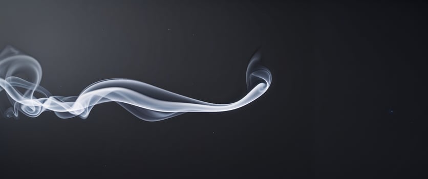 a black background with a white line of smoke photo