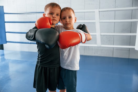 On the ring. Boys training boxing in the gym together photo