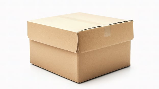 A brown cardboard box sitting on a white surface photo