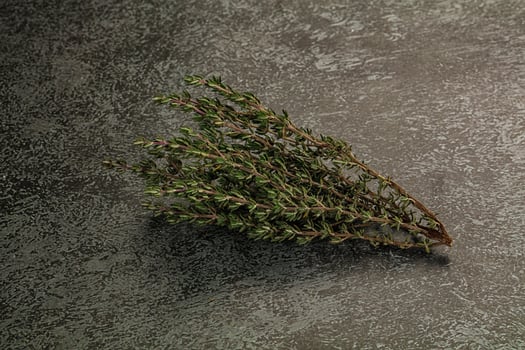 A bunch of herbs on a table photo