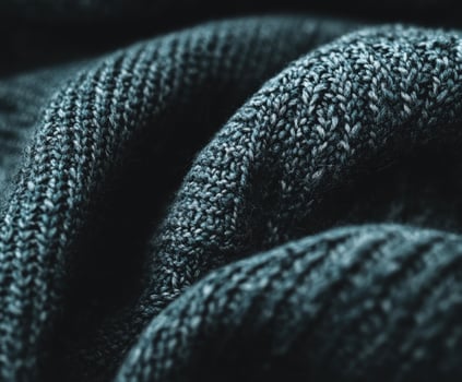 Textured beauty of boucle fabric showcasing intricate patterns and softness in a cozy setting photo