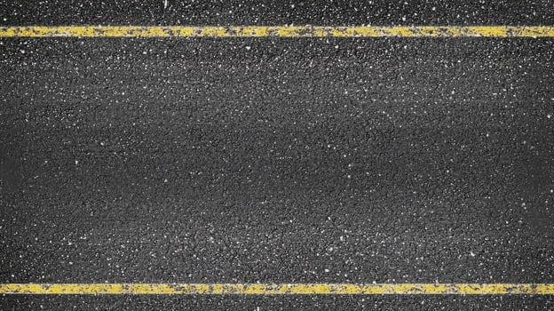 Asphalt road with yellow divider lines capturing urban transportation concept photo