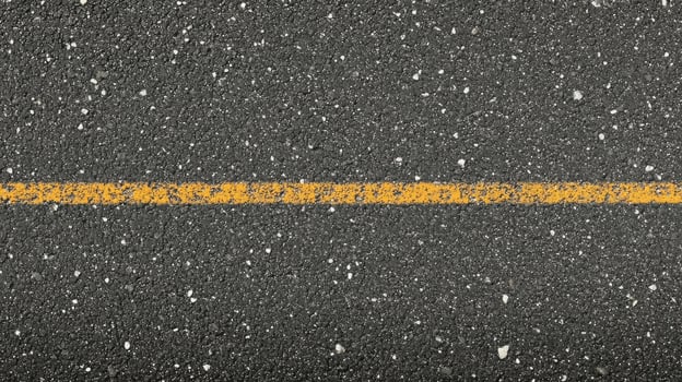 Yellow line on asphalt road surface for transportation concept and infrastructure photo