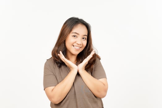 A woman is smiling and making a gesture with her hands photo