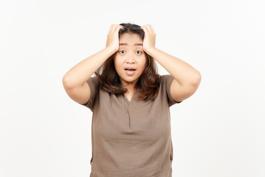 A woman is holding her head with both hands photo