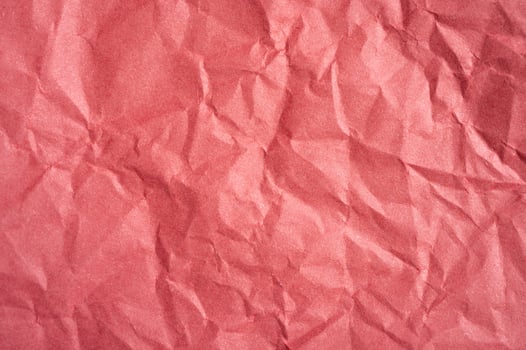Crumpled red paper sheet texture and background. photo