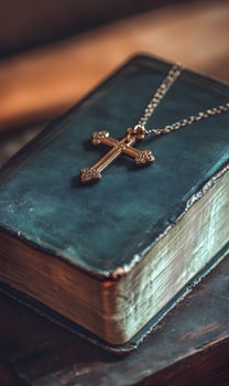 Antique Bible adorned with elegant golden cross, showcasing faith and timeless scriptures photo