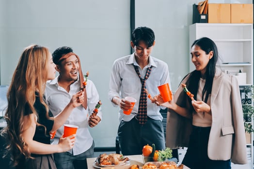 A group of people having a party with food photo