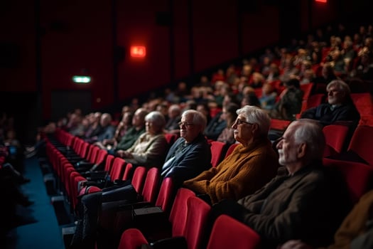 Senior audience watching a movie in a cinema photo