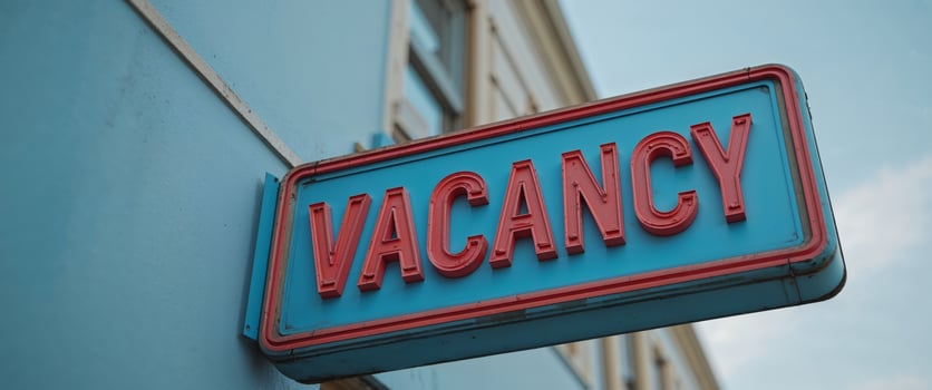 A blue and red sign that says vacancy photo