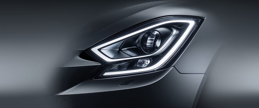 Sleek car headlight featuring modern design with bright LED lighting close up view capturing photo