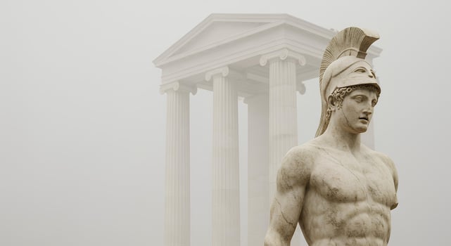 Historic marble sculpture of a spartan general alongside roman structures, representing classical military and architectural themes photo