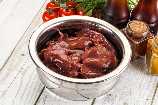 A metal container filled with meat and spices photo