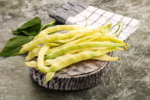 A pile of beans on a wooden table photo