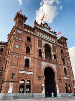 Madrid, Spain - August 22, 2024- Facade of Plaza de Toros in Madrid, Spain under a blue sky photo