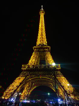 Paris, France - April 30, 2024 - Illuminated Eiffel Tower against the night sky in Paris, France photo
