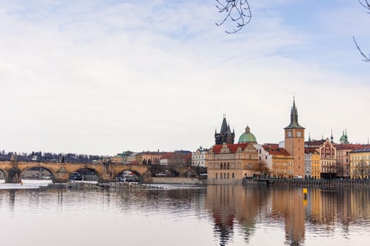 Charles Bridge reflecting on Vltava River in Prague, Czech Republic photo