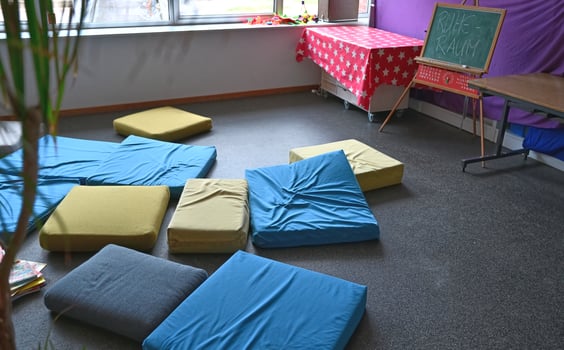 Cozy Relaxation Room with Colorful Cushions photo