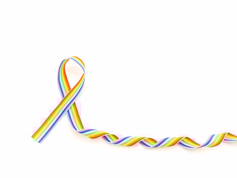 Rainbow cloth ribbon on a white background. Closeup. photo
