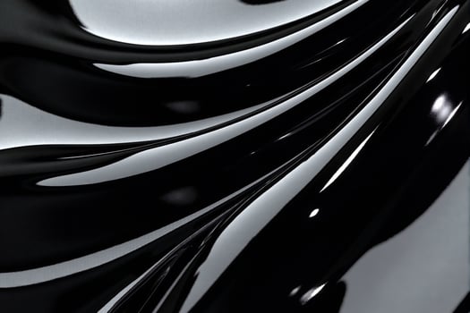 A black and white photo of a wavy surface