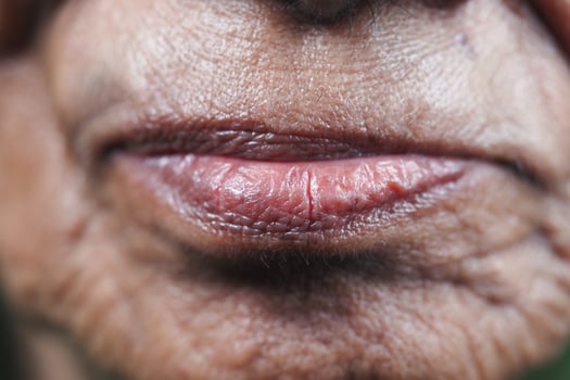 Close-up of an elderly person's lips highlighting age and wisdom photo