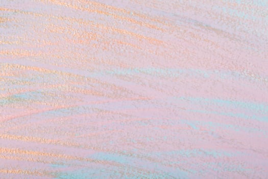 Golden brush strokes on pink pastel background. Dry brush technique. Hand painted background photo