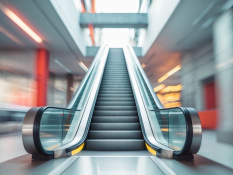 Modern Escalator Ascending in a Sleek Urban Setting photo