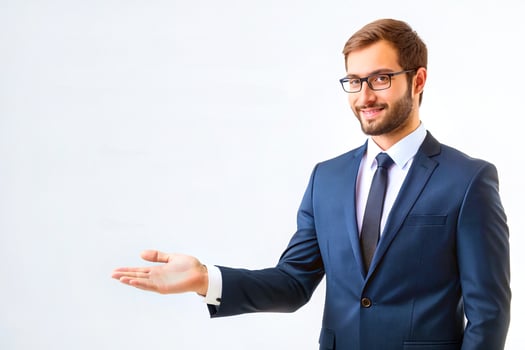 Welcome.A cheerful young man in a business suit extends a helping hand, points photo