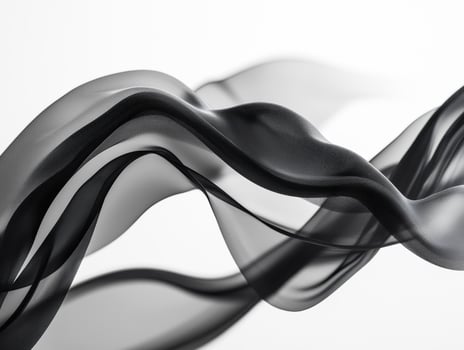 Black fabric forms elegant patterns on a light backdrop photo