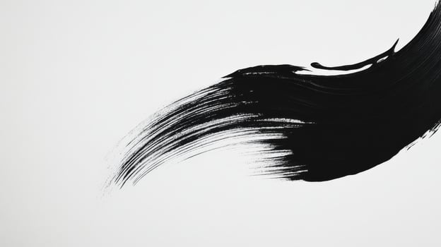 Black brush stroke on white paper photo