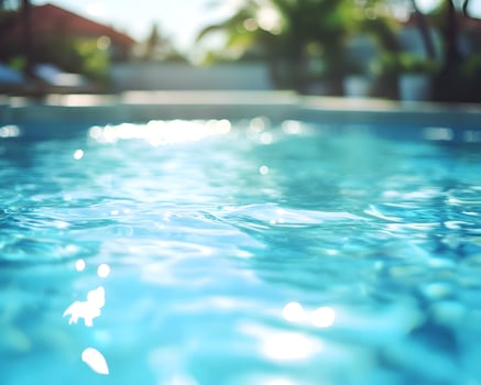 Swimming Pool Water Surface with Out-of-Focus Background photo