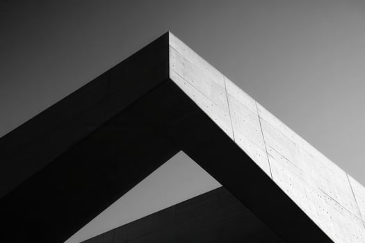 Abstract architectural structure showcasing geometric shapes in monochrome. photo