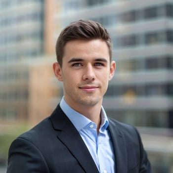 A young man in a suit and blue shirt photo