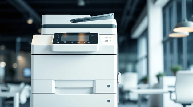 A white printer is sitting in a room photo