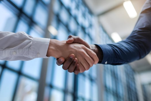 Diverse Business Professionals Shake Hands in Modern Office photo