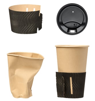 Black round plastic lid for paper cups and paper cup, isolated background photo