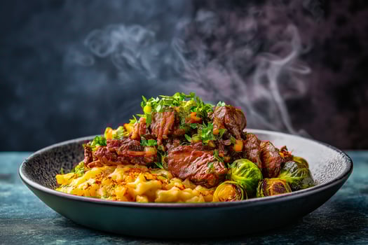 Moody marinated meat with spatzle and brussels sprouts photo