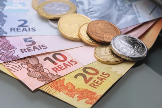 Brazilian Real Bills and Coins in Detail on Dark Surface photo