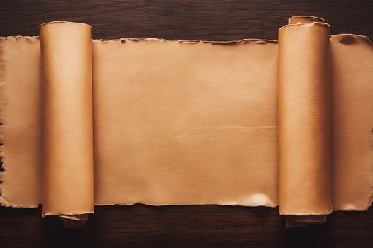 Old parchment scroll on wooden table photo