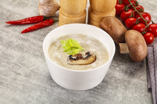 A bowl of soup with mushrooms and vegetables photo