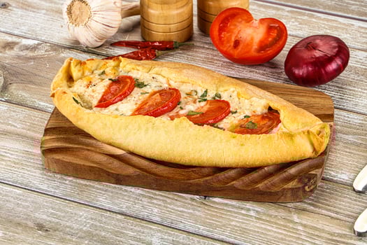 A bread with tomatoes and onions on it photo