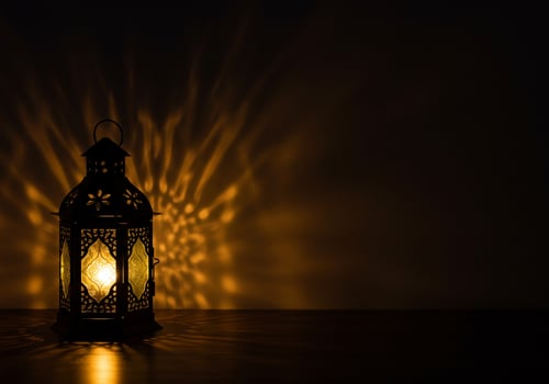 A Glimmer of Hope. Illuminated Lantern in the Dark photo