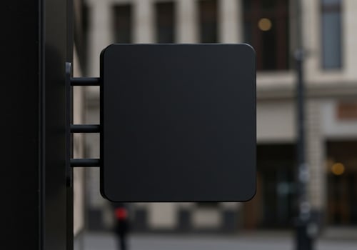 Blank Black Square Sign Mockup on City Building Background photo